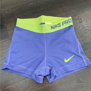 purple and yellow nike pros